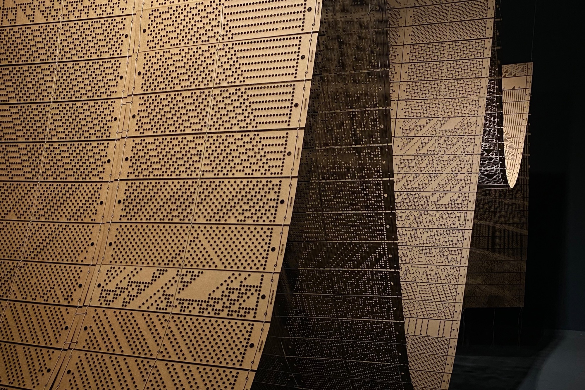 Detail: curved strips made of perforated panels with dot patterns